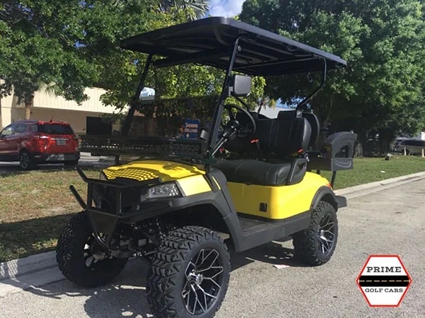 Yellow Aluma 4 Passenger Lifted Golf Cart affordable golf cart rental, golf cart rent kentucky